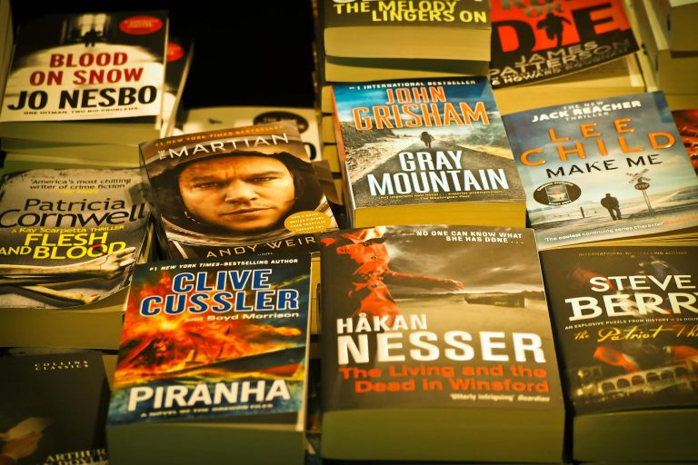 A collection of bestselling thriller novels prominently displayed in a bookstore setting.